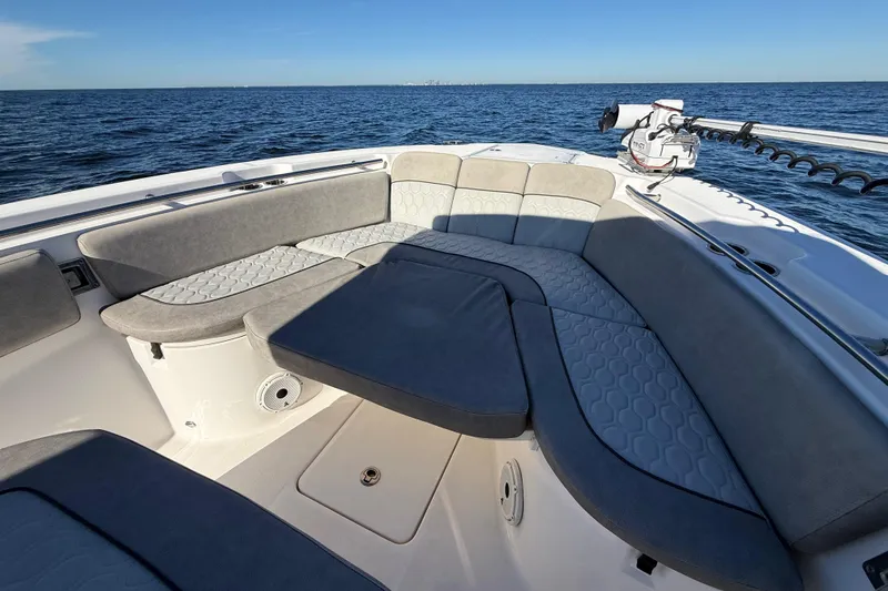 Slide: The Image of 2021 Sea Fox 288 Commander boat interior with cushioned seating, ocean view. - 44