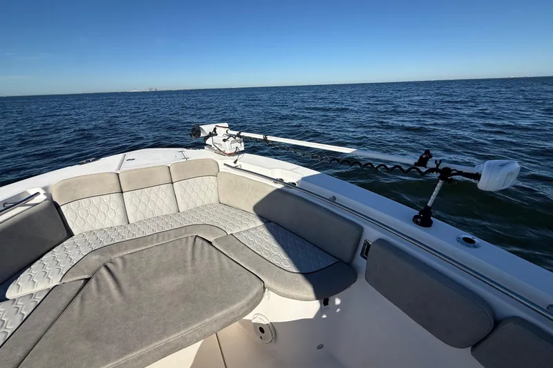 Slide: The Image of 2021 Sea Fox 288 Commander boat interior with cushioned seating, on open water. - 45