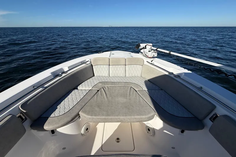 Slide: The Image of 2021 Sea Fox 288 Commander boat interior with cushioned seating, on open water. - 46