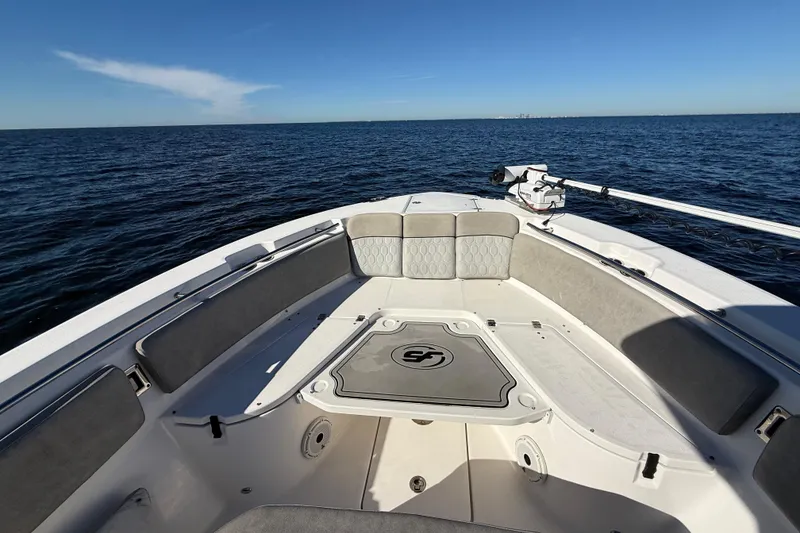 Slide: The Image of 2021 Sea Fox 288 Commander boat interior with seating, on open water under clear sky. - 47