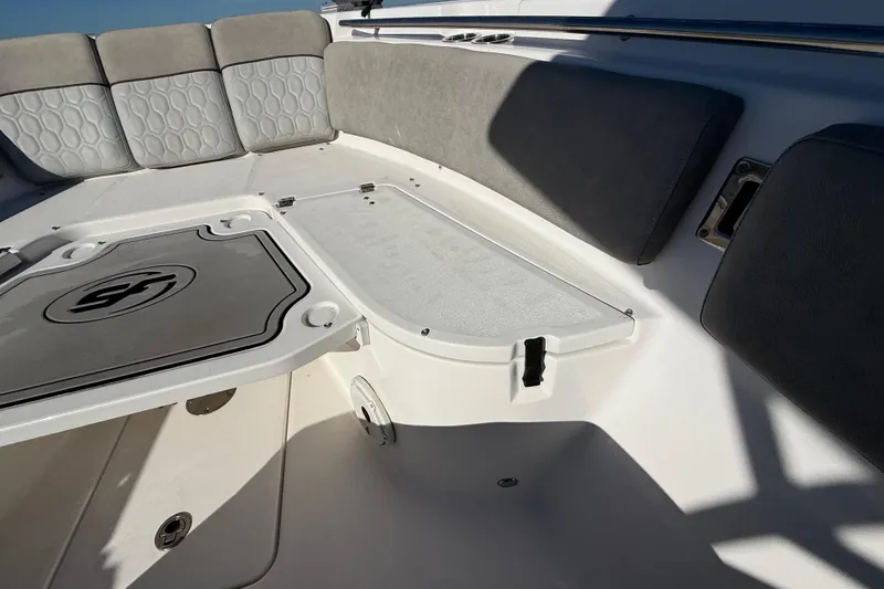 Slide: The Image of 2021 Sea Fox 288 Commander boat interior with cushioned seating and storage compartments. - 48