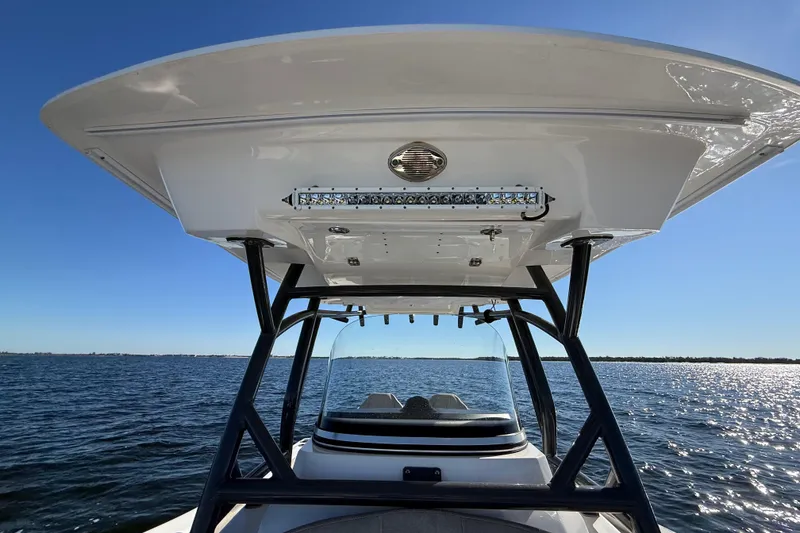 Slide: The Image of 2021 Sea Fox 288 Commander boat on open water under clear blue sky. - 67