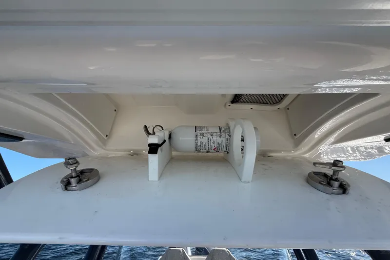 Slide: The Image of 2021 Sea Fox 288 Commander storage compartment with mounted fire extinguisher. - 69