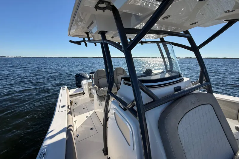 Slide: The Image of 2021 Sea Fox 288 Commander boat on open water, showcasing sleek design and spacious deck. - 70