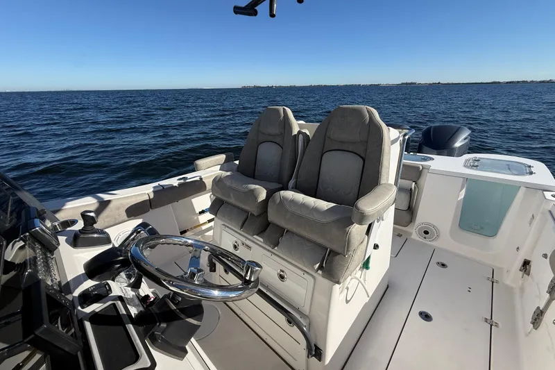Slide: The Image of 2021 Sea Fox 288 Commander boat interior with dual captain seats on open water. - 73