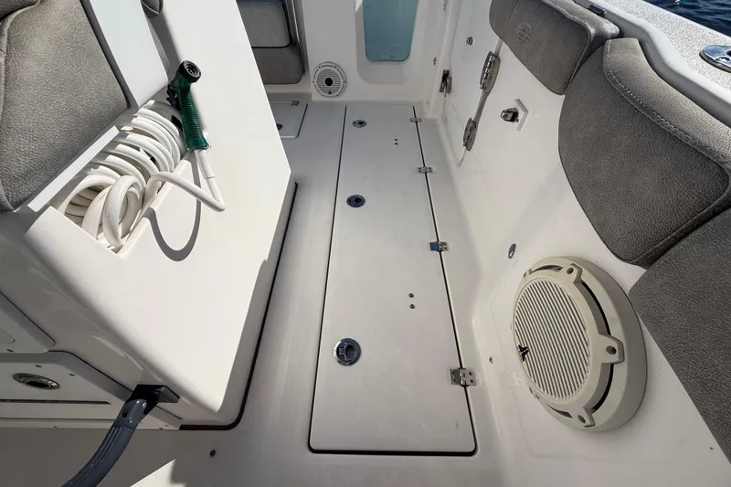Slide: The Image of 2021 Sea Fox 288 Commander boat interior with hose storage and speaker. - 79