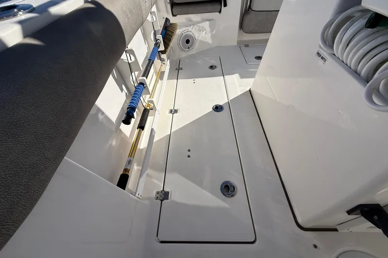 Slide: The Image of Interior view of a 2021 Sea Fox 288 Commander boat deck with storage compartments. - 80