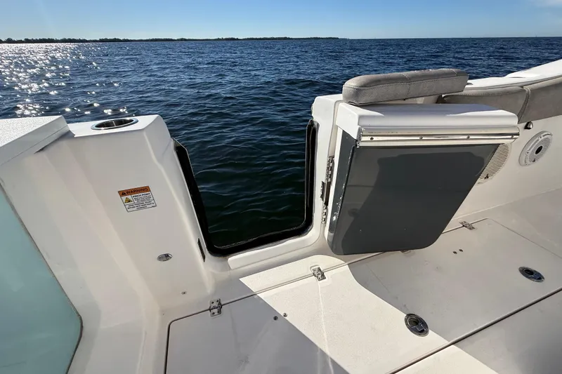 Slide: The Image of 2021 Sea Fox 288 Commander boat with open side door, ocean view. - 84