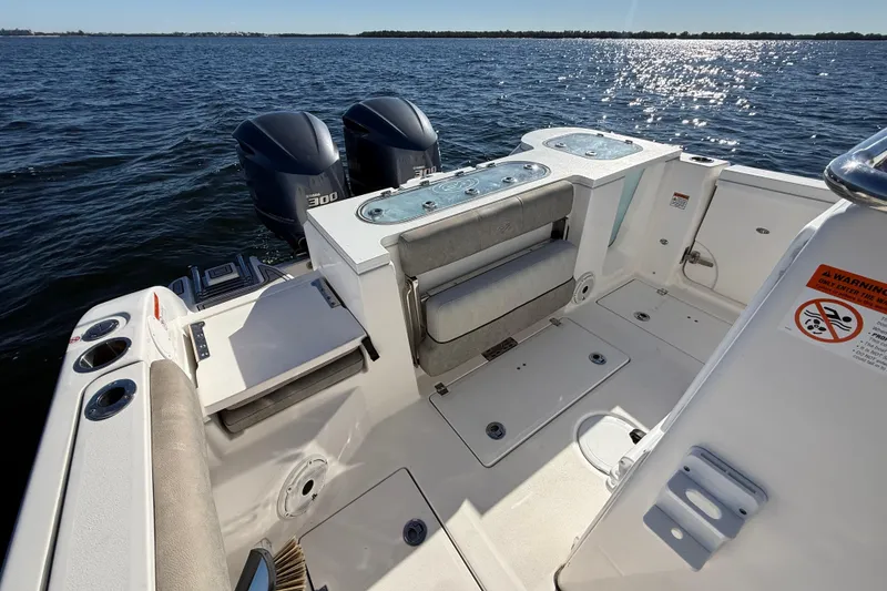 Slide: The Image of 2021 Sea Fox 288 Commander boat interior with dual engines on a sunny day. - 88