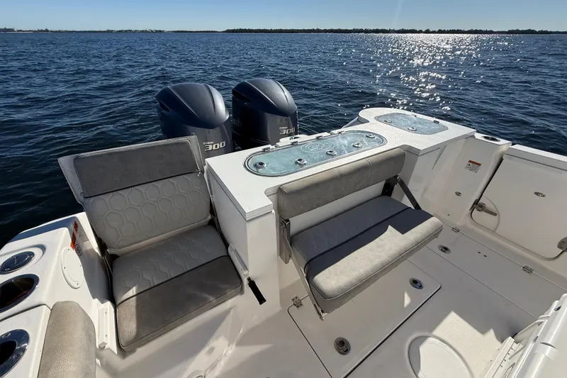 Slide: The Image of 2021 Sea Fox 288 Commander boat interior with dual engines on open water. - 89