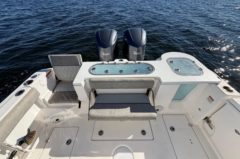 Slide: The Image of 2021 Sea Fox 288 Commander boat with dual engines and spacious seating on open water. - 90