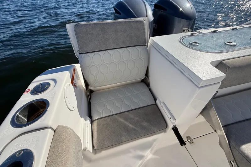 Slide: The Image of 2021 Sea Fox 288 Commander boat seating area with cup holders and ocean view. - 91