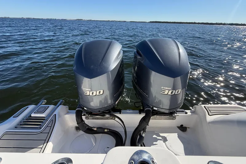 Slide: The Image of Twin Yamaha 300 engines on a 2021 Sea Fox 288 Commander boat in open water. - 98