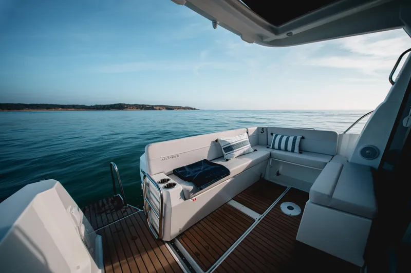Slide: The Image of Luxurious 2026 Beneteau Antares 9 V2 yacht interior with ocean view and comfortable seating. - 15