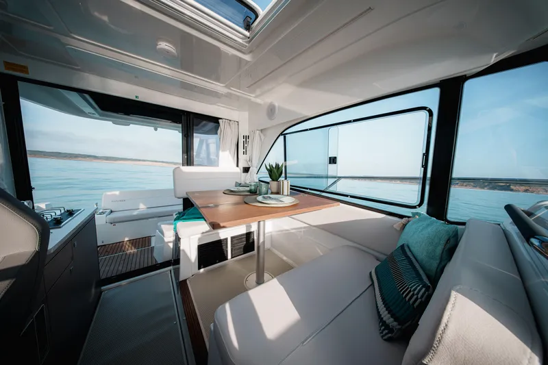 Slide: The Image of Interior of 2026 Beneteau Antares 9 V2 yacht with elegant seating and dining area. - 20