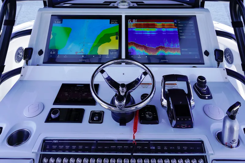 Slide: The Image of Helm of 2026 Invincible 40 Catamaran with advanced navigation displays and controls. - 15