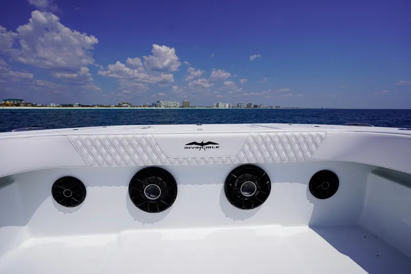 Slide: The Image of 2026 Invincible 40 Catamaran on open sea with city skyline in background. - 16