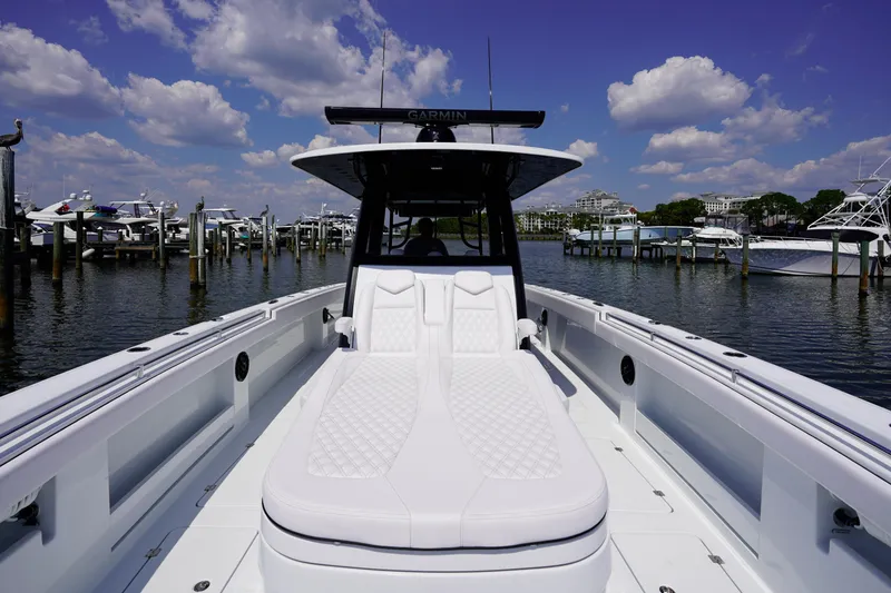 Slide: The Image of 2026 Invincible 40 Catamaran docked, featuring sleek design and luxurious seating. - 17