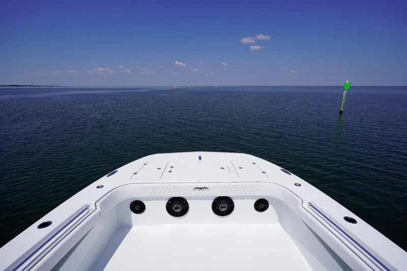 Slide: The Image of Invincible 40 Catamaran 2026 on open water, clear sky, and navigational markers. - 19