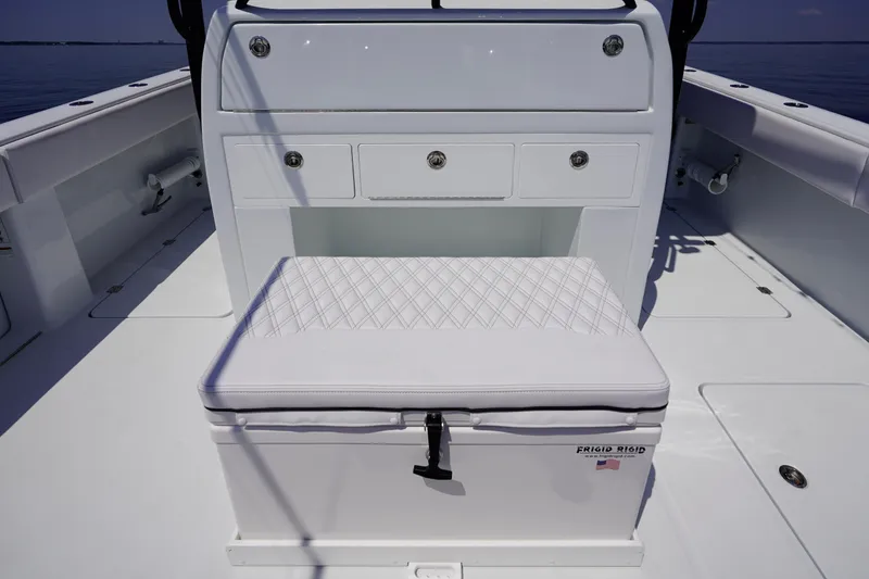 Slide: The Image of 2026 Invincible 40 Catamaran interior with cushioned seating and storage drawers. - 24