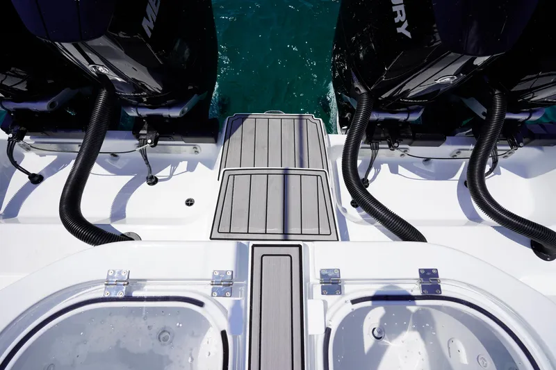 Slide: The Image of Rear view of 2026 Invincible 40 Catamaran with dual Mercury outboard engines. - 28