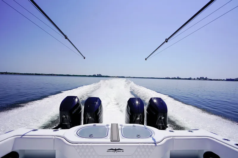 Slide: The Image of 2026 Invincible 40 Catamaran cruising on calm waters with powerful engines. - 33