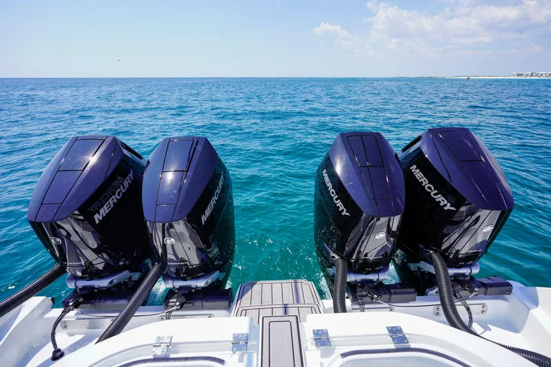 Slide: The Image of 2026 Invincible 40 Catamaran with four Mercury outboard engines on open sea. - 34