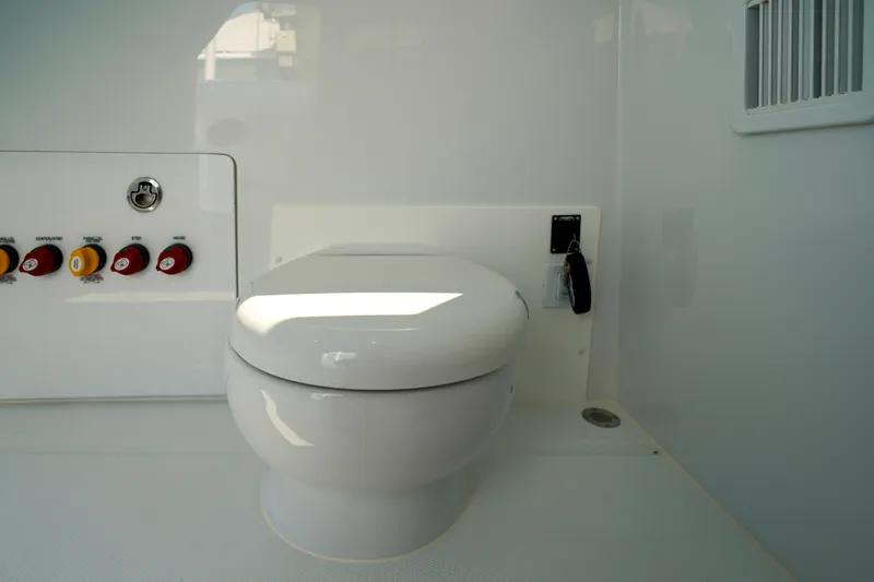 Slide: The Image of Toilet area in 2026 Invincible 40 Catamaran, featuring control panel and modern design. - 39