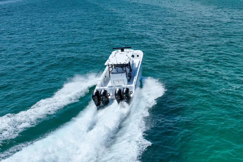 Slide: The Image of 2026 Invincible 40 Catamaran cruising on open blue water. - 44