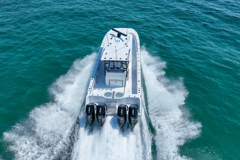 Slide: The Image of 2026 Invincible 40 Catamaran speeding on open water, showcasing powerful engines and sleek design. - 48