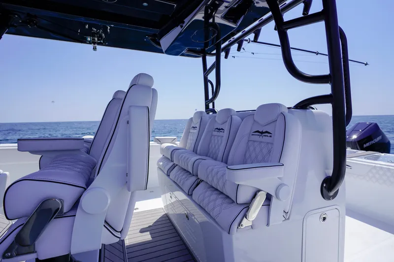 Slide: The Image of Luxurious seating on 2026 Invincible 40 Catamaran, featuring sleek design and ocean backdrop. - 5