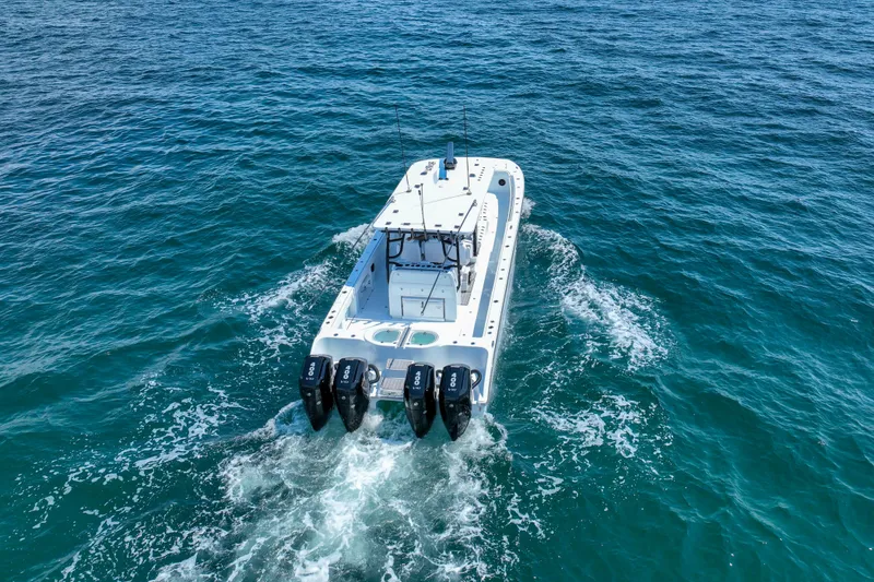 Slide: The Image of 2026 Invincible 40 Catamaran cruising on open blue ocean waters. - 54