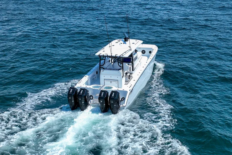 Slide: The Image of Invincible 40 Catamaran 2026 cruising on open ocean waters. - 55