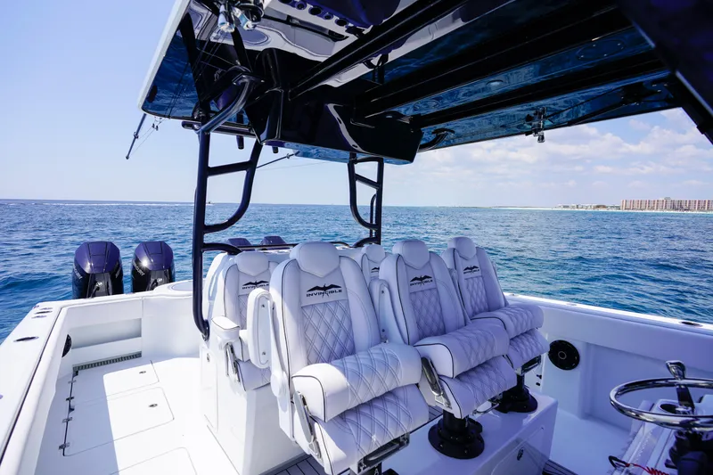 Slide: The Image of 2026 Invincible 40 Catamaran interior with luxurious seating on open water. - 6