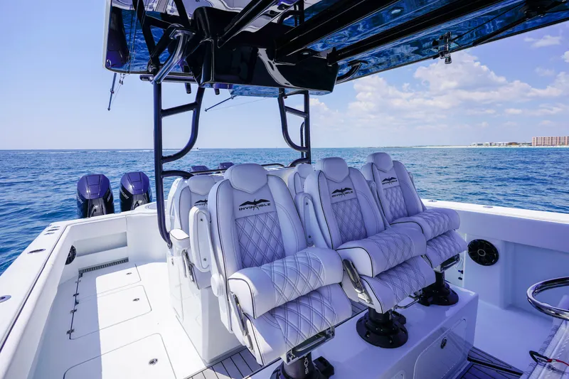 Slide: The Image of Invincible 40 Catamaran 2026 interior with luxurious seating on open water. - 7