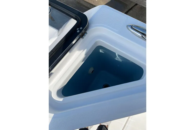 Slide: The Image of Open storage compartment on 2023 Bertram 28 CC boat, featuring sleek design and durable materials. - 15