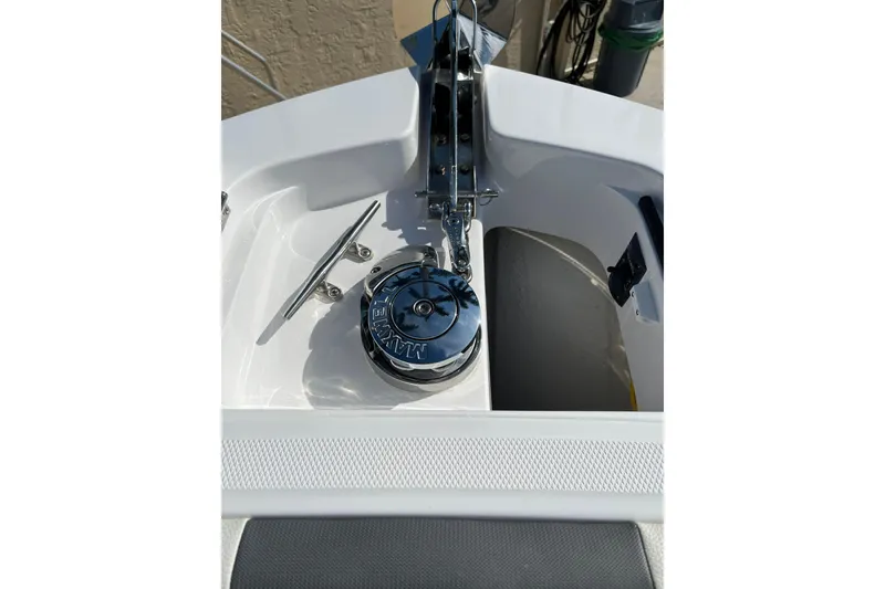 Slide: The Image of 2023 Bertram 28 CC boat anchor system with chrome finish and cleat. - 17
