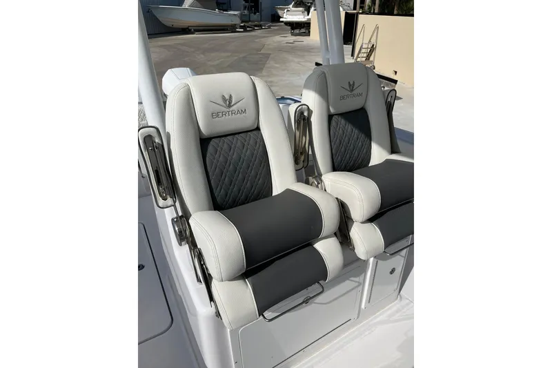 Slide: The Image of 2023 Bertram 28 CC boat seats with elegant black and white upholstery. - 5