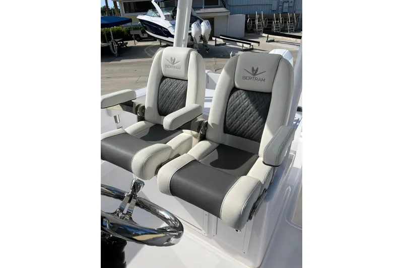 Slide: The Image of 2023 Bertram 28 CC boat seats with luxurious design and comfortable armrests. - 6