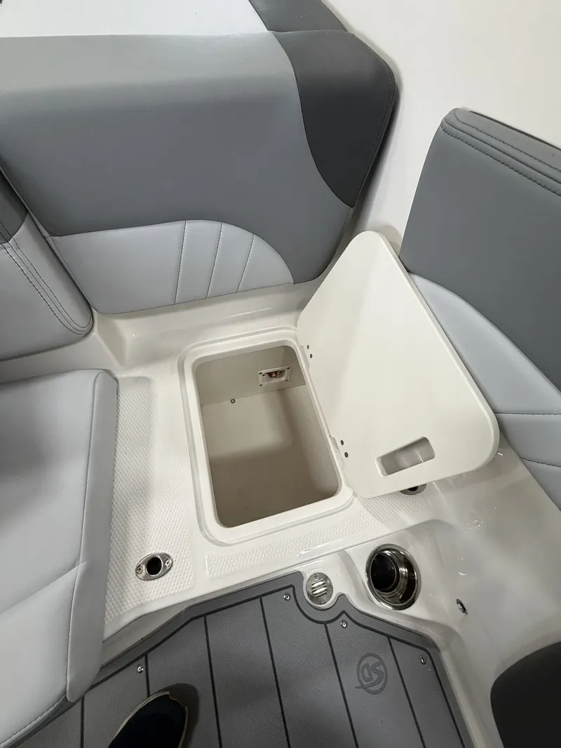 Slide: The Image of Interior of Chaparral SSi 21 boat, seating area with storage compartment. - 10