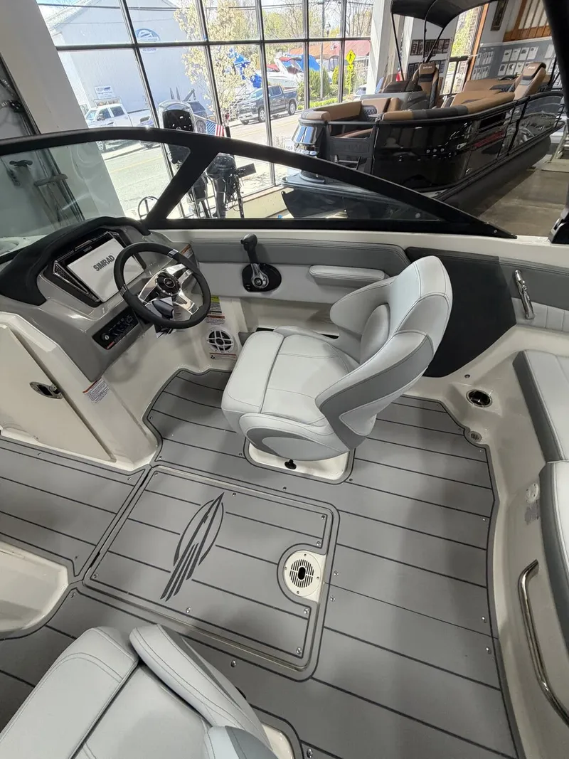 Slide: The Image of Interior of a 2026 Chaparral SSi 21 boat with gray seating. - 11