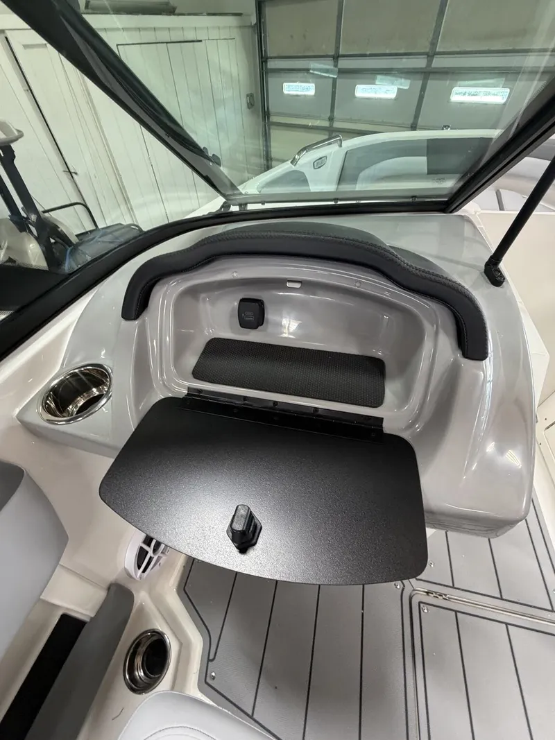 Slide: The Image of Interior of 2026 Chaparral SSi 21 with open storage compartment. - 16