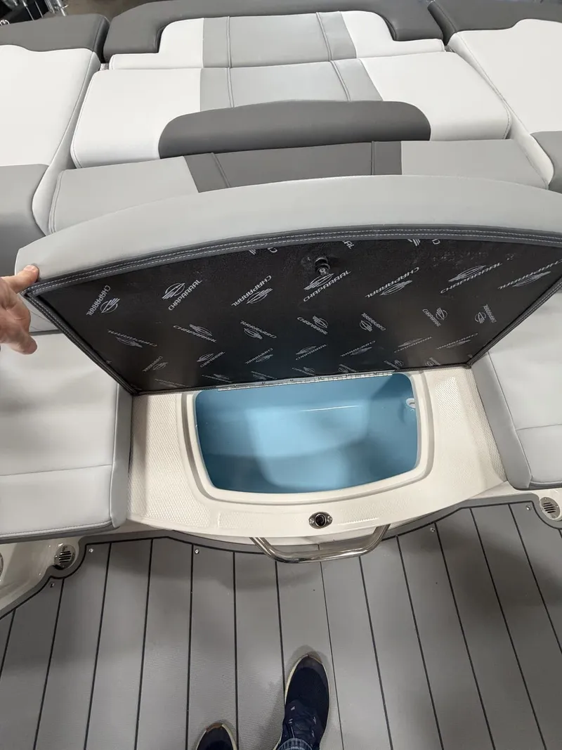 Slide: The Image of 2026 Chaparral SSi 21 boat with open storage compartment lid. - 7