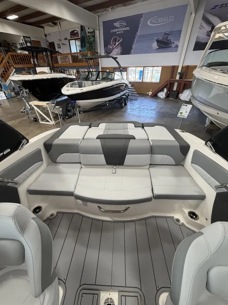Slide: The Image of Interior of a 2026 Chaparral SSi 21 boat in showroom. - 8