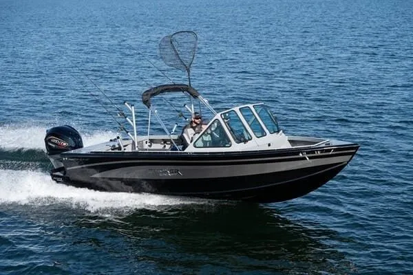 Slide: The Image of 2026 Smoker Craft Phantom 20x2 boat on the water. - 2