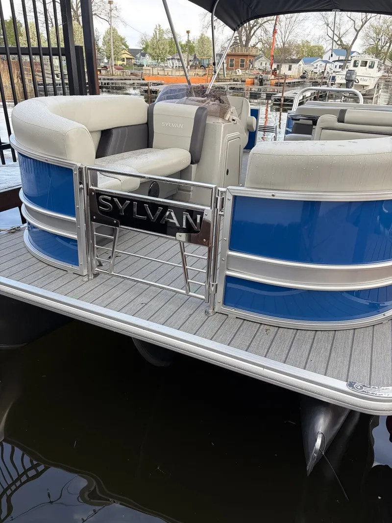 Slide: The Image of Sylvan Mirage Cruise 8520 pontoon boat, 2026 model, docked at marina. - 7