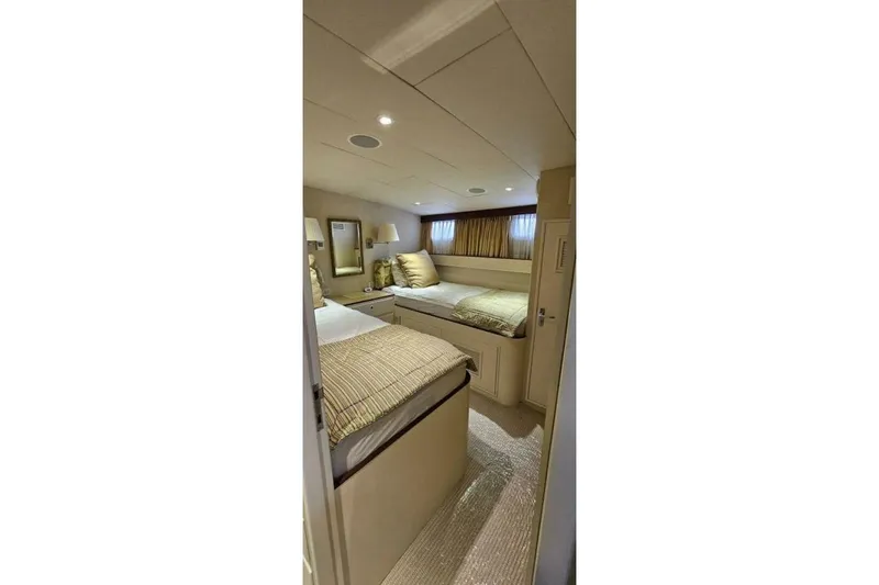 Slide: The Image of Cozy cabin interior of 1969 Derecktor 68 Hunt Motor Yacht with twin beds and elegant decor. - 17