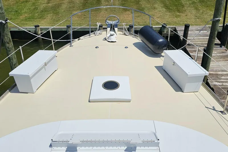 Slide: The Image of 1969 Derecktor 68 Hunt Motor Yacht deck with storage boxes and railing. - 2