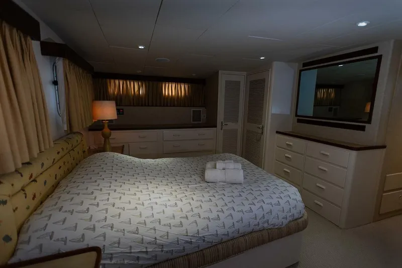 Slide: The Image of Luxurious bedroom interior of 1969 Derecktor 68 Hunt Motor Yacht with elegant furnishings. - 20