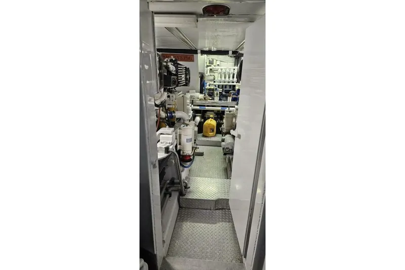 Slide: The Image of Engine room of 1969 Derecktor 68 Hunt Motor Yacht, showcasing machinery and equipment. - 21